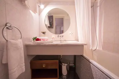 a room with two bunk beds and a sink at Résidence Grand Roc - Campanules 303 - Happy Rentals in Chamonix-Mont-Blanc