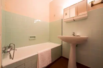 a bathroom with a sink and a bath tub and a sink at Résidence Grands Montets 110 - Happy Rentals in Chamonix-Mont-Blanc