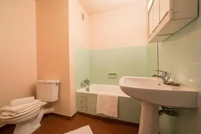 a bathroom with a sink and a toilet and a tub at Résidence Grands Montets 110 - Happy Rentals in Chamonix-Mont-Blanc