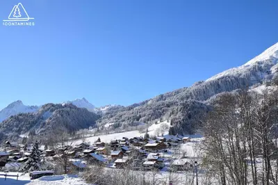 a small village in the snow on a mountain at Location Montagne in Les Contamines-Montjoie