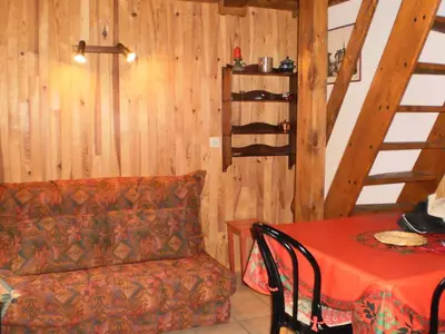 a living room with a couch and a table at Location Montagne in Les Contamines-Montjoie