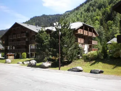 a large building on the side of a road at Location Montagne in Les Contamines-Montjoie