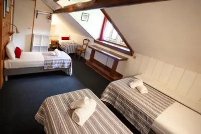 a room with two beds in a room at La Chaumière Mountain Lodge in Chamonix-Mont-Blanc