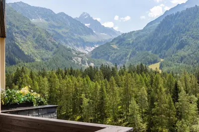 a playground in front of a large building with a park at Résidence Grand Roc - Campanules 415 - Happy Rentals in Chamonix-Mont-Blanc