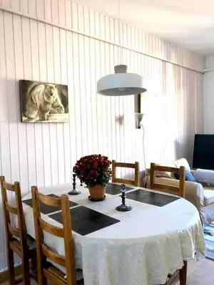 a dining room table with a dog on the wall at Appartement Alexandra in Chamonix-Mont-Blanc