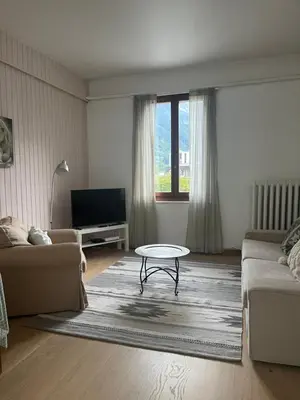 a living room with a couch and a coffee table at Appartement Alexandra in Chamonix-Mont-Blanc
