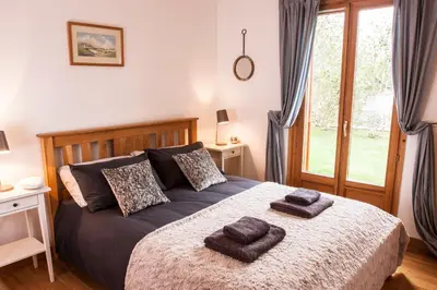 a bedroom with a bed with two towels on it at Chalet Brio in Samoëns