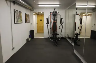 a room with a gym with tread machines at Chalet Brio in Samoëns