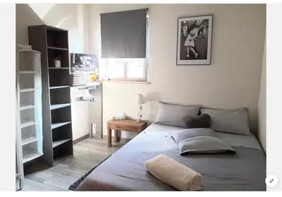 a bedroom with a bed and a book shelf at Casa Mia in Saint-Gervais-les-Bains