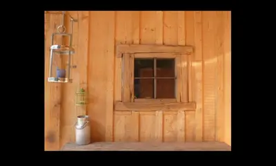 a door with a window in a wooden wall at Casa Mia in Saint-Gervais-les-Bains