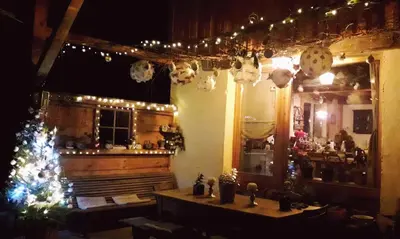 a room with a christmas tree and lights at Casa Mia in Saint-Gervais-les-Bains