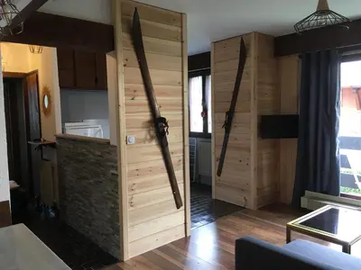 a room with a large wooden door in a room at Les Esserts in Les Houches