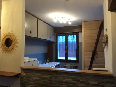 a small kitchen with a sink and a window at Les Esserts in Les Houches