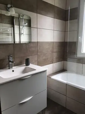 a bathroom with a sink and a bath tub at Les Esserts in Les Houches