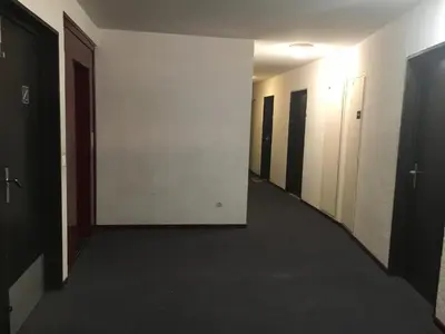 a hallway of an office building with a long corridor at Art Studio in Chamonix-Mont-Blanc