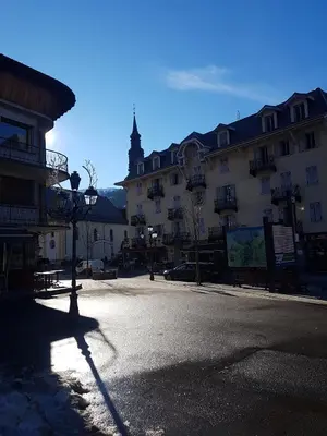 a city street with a building and a street light at Central Sweet Home in Saint-Gervais-les-Bains