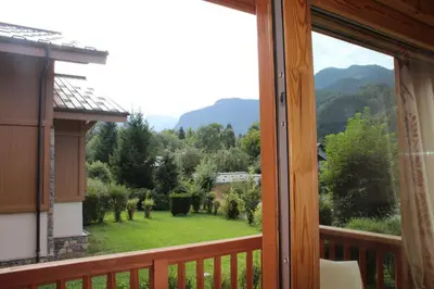 a balcony with a view of a yard at Reine des Prés in Samoëns