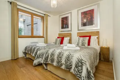 a bedroom with two beds and a window at Biolay 1 in Chamonix-Mont-Blanc