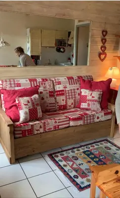 a living room with a wooden table and a couch at Savran in Saint-Gervais-les-Bains