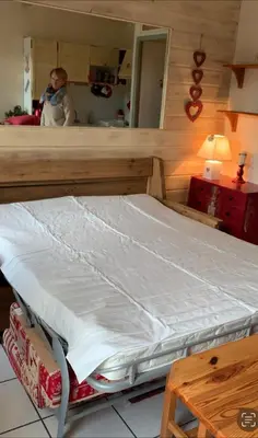 a room with a balcony with a door and two windows at Savran in Saint-Gervais-les-Bains