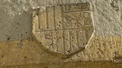 a stone wall with a relief on it at appartement château de la Comtesse in Saint-Gervais-les-Bains