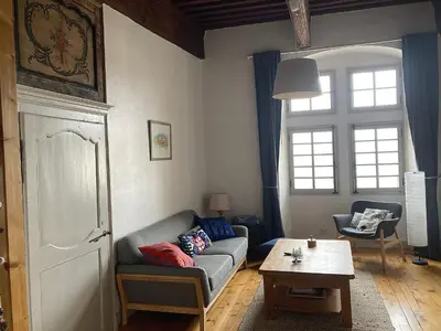 a living room with a couch and a table at appartement château de la Comtesse in Saint-Gervais-les-Bains