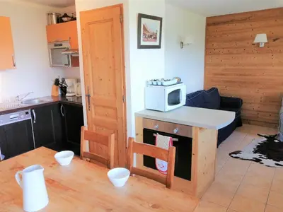 a kitchen with a microwave on top of a counter at Appartement 3 pièces pour 6 personnes avec parking à Morillon 1100 - FR-1-815-56 in Morillon