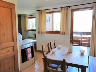 a bedroom with two white beds and a window at Appartement 3 pièces pour 6 personnes avec parking à Morillon 1100 - FR-1-815-56 in Morillon
