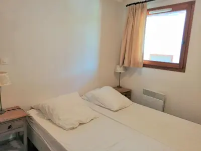a bedroom with two beds and a window at Appartement 3 pièces pour 6 personnes avec parking à Morillon 1100 - FR-1-815-56 in Morillon