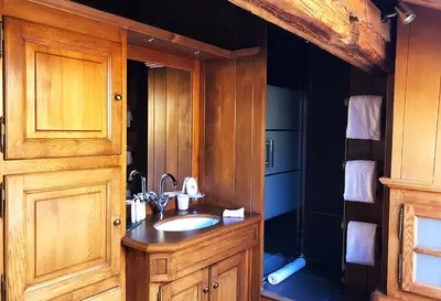 a bathroom with a sink and a shower at Chalet des Fermes de Marie, avec services, Collection Chalets des Fermes in Megève