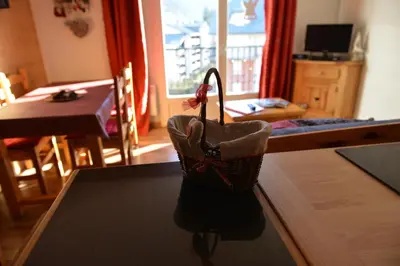 a purse sitting on a table in a living room at Le Grand Panorama 5 Étage Balcon Vue sur La Montagne in Saint-Gervais-les-Bains