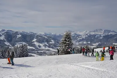 a group of people standing on top of a ski slope at Le Grand Panorama 5 Étage Balcon Vue sur La Montagne in Saint-Gervais-les-Bains