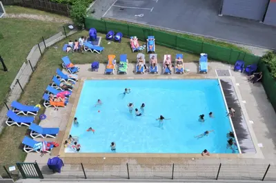 an overhead view of people in a swimming pool at Le Grand Panorama 5 Étage Balcon Vue sur La Montagne in Saint-Gervais-les-Bains