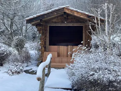 a wooden out house with snow on the ground at Chalet Chatel, avec services, Collection Chalets des Fermes - Megève in Megève