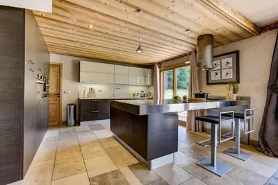 a kitchen with a large island in the middle at Chalet Sanaz in Chamonix-Mont-Blanc
