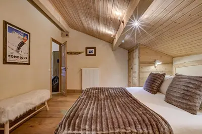 a bedroom with a large bed in a room at Chalet Sanaz in Chamonix-Mont-Blanc