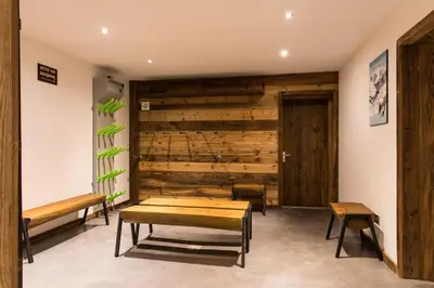 a room with a bench and a wooden wall at Chalet Belachat in Chamonix-Mont-Blanc