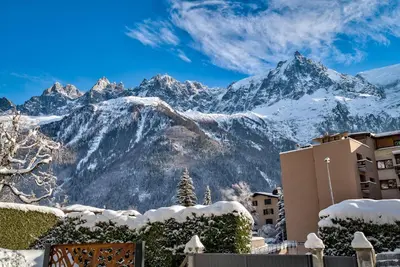 a view of a mountain range with snow covered mountains at Chalet Belachat in Chamonix-Mont-Blanc