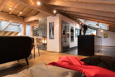 a room with a bed and a desk in it at Chalet Belachat in Chamonix-Mont-Blanc