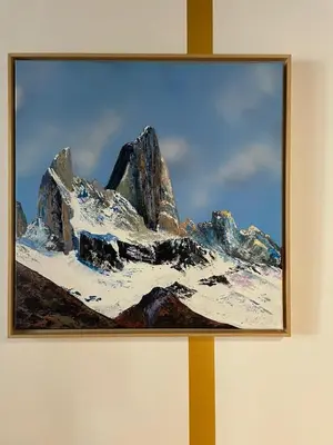a painting of a snow covered mountain on a wall at Hotel La Verticale in Chamonix-Mont-Blanc