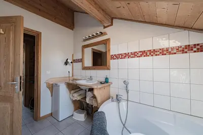 a bedroom in a log cabin with a bed at Appartement Orion à Saint Gervais, proche Chamonix in Saint-Gervais-les-Bains