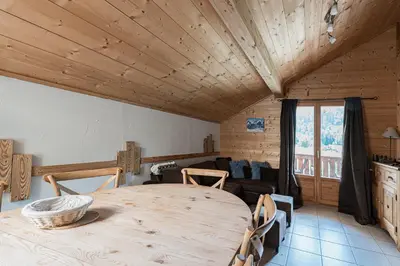 a living room with a couch and a table at Appartement Orion à Saint Gervais, proche Chamonix in Saint-Gervais-les-Bains