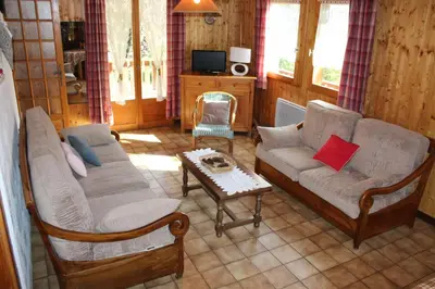 a living room with two couches and a coffee table at Tifanlo in Samoëns