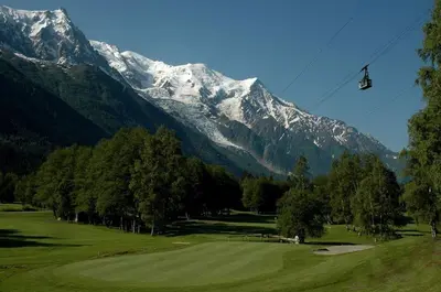 a ski lift in front of a snow covered mountain at Quartz-Montblanc in Chamonix-Mont-Blanc