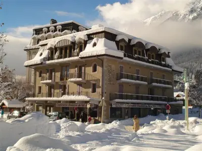 a large building covered in snow in front at Quartz-Montblanc in Chamonix-Mont-Blanc