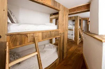 a bunk bed room with two bunk beds at Chalet des Souchettes - Chamonix All Year in Chamonix-Mont-Blanc