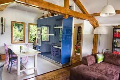 a living room with a table and a couch at Le Mont Fleuri Saint Gervais Les Bains in Saint-Gervais-les-Bains