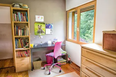 a room with a desk and a pink chair at Le Mont Fleuri Saint Gervais Les Bains in Saint-Gervais-les-Bains