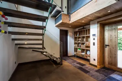 a wine cellar with a spiral staircase in a house at Chalet Rass in Chamonix-Mont-Blanc
