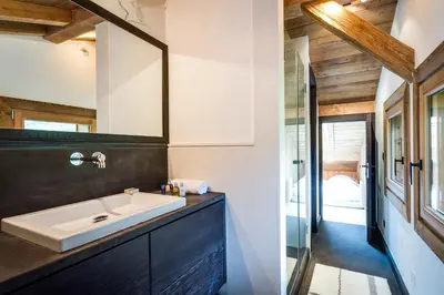 a bathroom with a sink and a mirror at Chalet Rass in Chamonix-Mont-Blanc